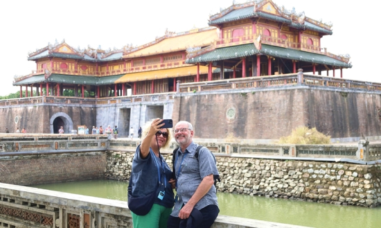 International visitors checking in during their tour of the Citadel. Photo: Huu Phuc 